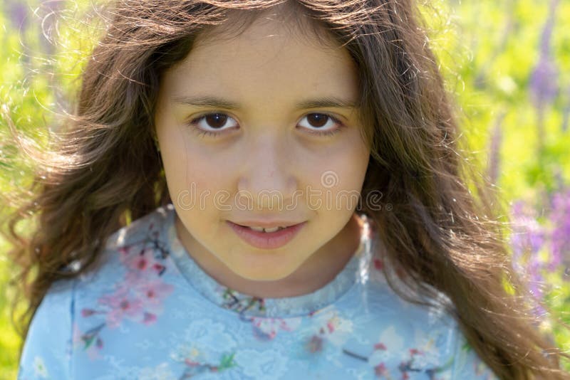 Portrait of a Beautiful Muslim Teenager Girl with Brown Eyes and Long, Curly Hair on a Field of Flowers Stock Image - Image of hair, freedom: 154959585 Portrait of a Beautiful Muslim Teenager Girl with Brown Eyes and Long, Curly Hair on a Field of Flowers Stock Image - Image of hair, freedom: 154959585