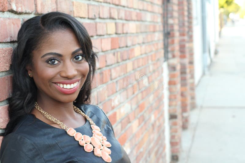 Portrait of a beautiful natural young African woman smiling royalty free stock photos Portrait of a beautiful natural young African woman smiling royalty free stock photos