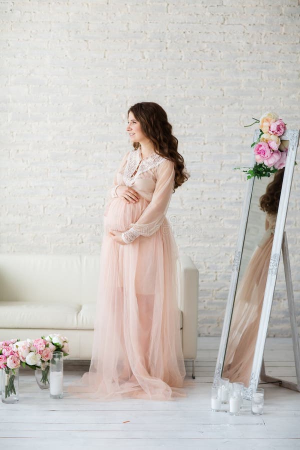 Portrait of beautiful pregnant woman in studio