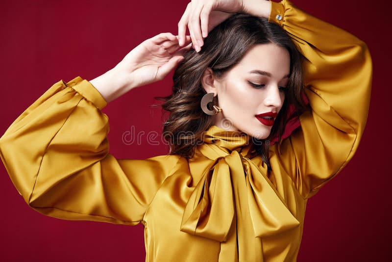 Portrait beautiful pretty woman red lipstick jewelry earrings brunette hair cosmetic makeup fashion clothes beauty salon