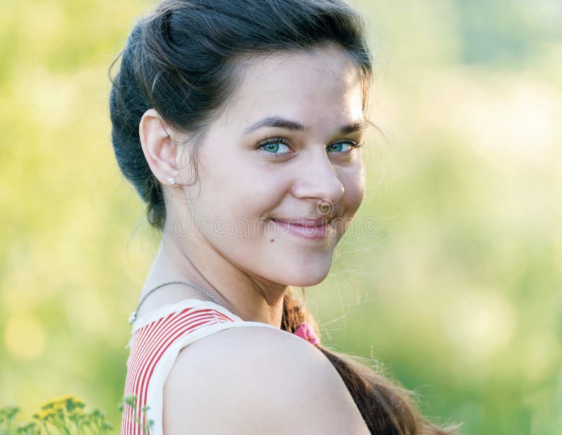 Portrait of beautiful Russian girl in the nature