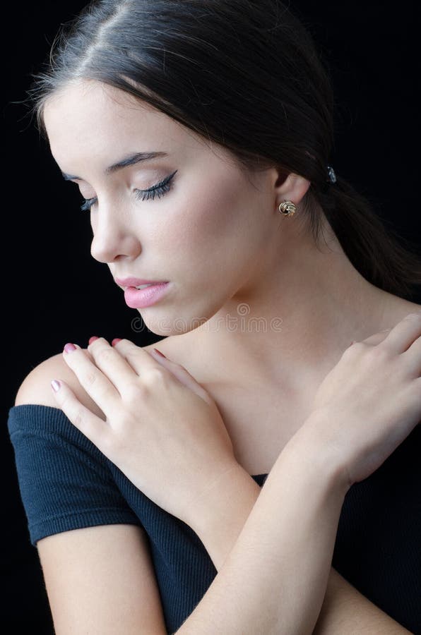 Portrait of beautiful sad girl with closed eyes isolated on black stock images Portrait of beautiful sad girl with closed eyes isolated on black stock images