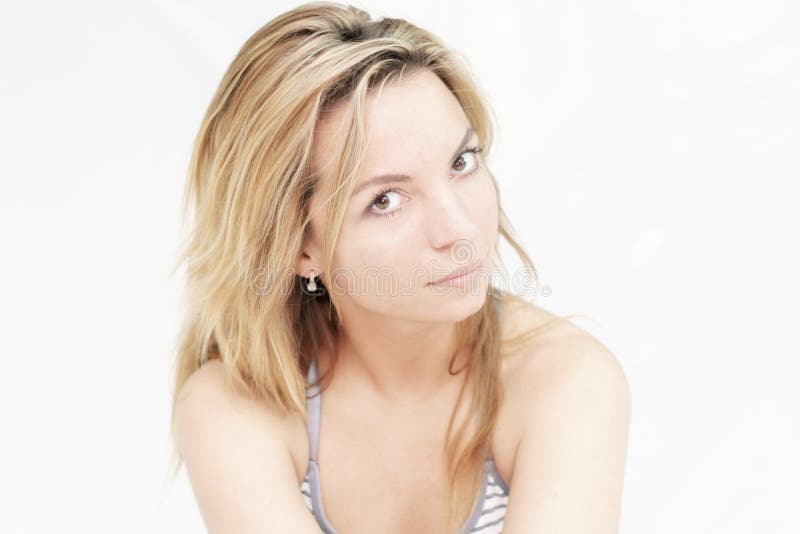 Portrait of beautiful sexy slim young woman with long hair and gentle look on white background. royalty free stock photography Portrait of beautiful sexy slim young woman with long hair and gentle look on white background. royalty free stock photography