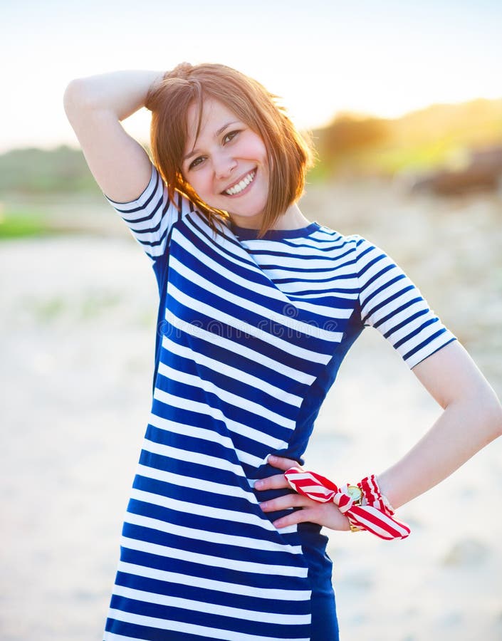 Portrait of the beautiful teen girl near the sea