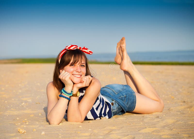 Portrait of the beautiful teen girl near the sea