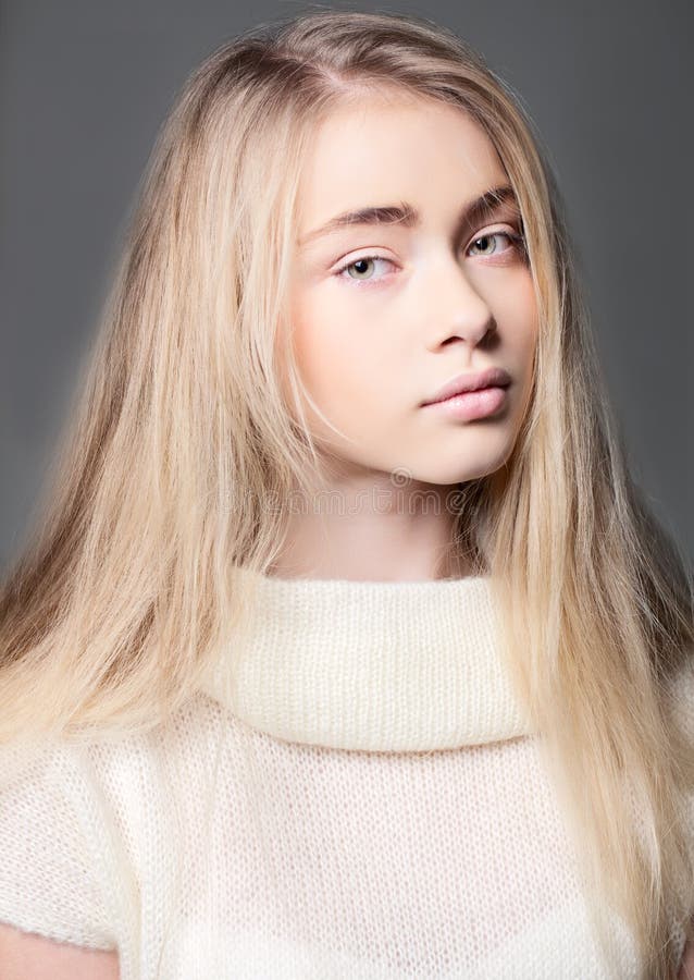 Portrait of a Beautiful Teenager Girl with Long Hair in Studio Stock Portrait of a Beautiful Teenager Girl with Long Hair in Studio Stock