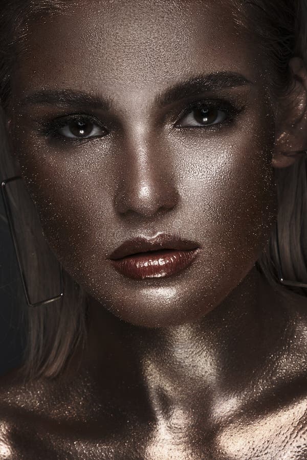 Portrait Of Beautiful Woman With Art Space Makeup On Her Face And Body Glitter Face Stock