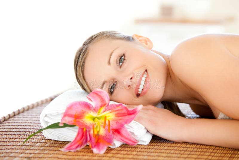 Portrait of a beautiful woman having a massage stock image