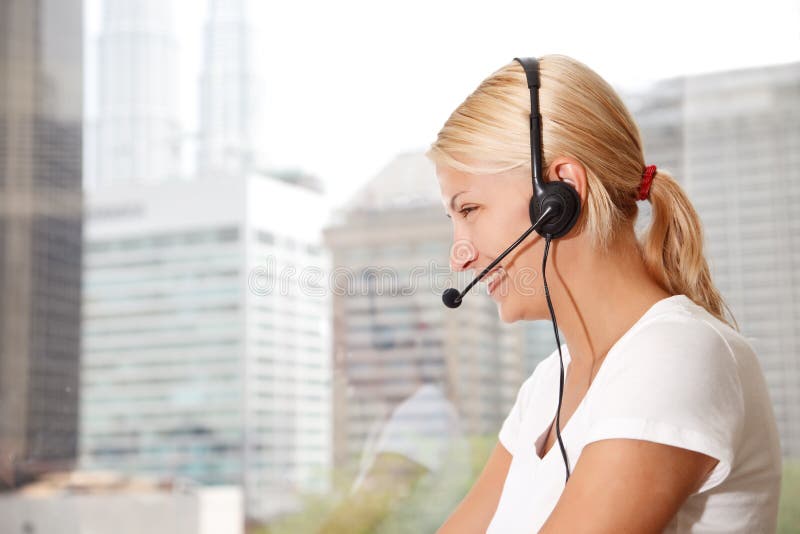 Portrait of a beautiful woman with headset