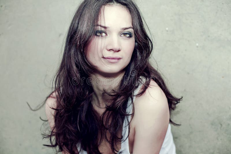 Portrait of beautiful woman with long brown hair
