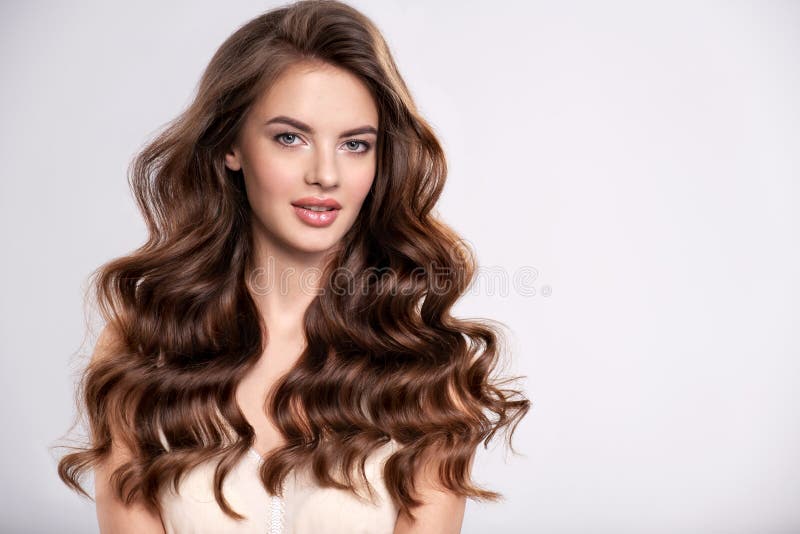 Portrait of a beautiful woman with a long brown hair