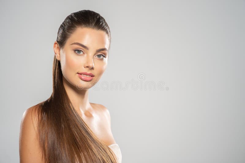 Portrait of a beautiful woman with a long hair. Young brunette model with beautiful hair - on white background. Young royalty free stock photography Portrait of a beautiful woman with a long hair. Young brunette model with beautiful hair - on white background. Young royalty free stock photography