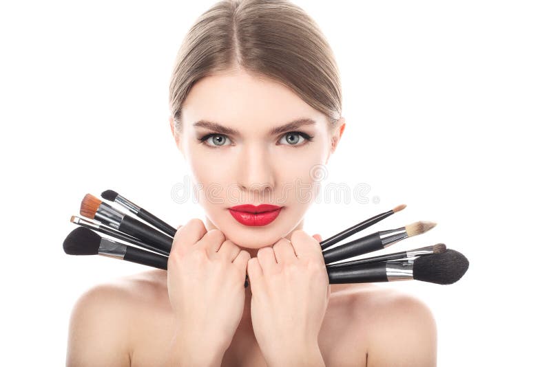 Portrait of the beautiful woman with make-up brushes stock image Portrait of the beautiful woman with make-up brushes stock image