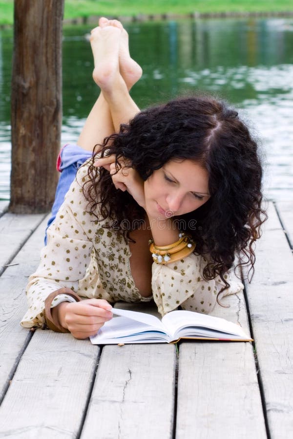 Portrait of a beautiful woman reading a book