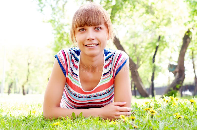 Portrait of a beautiful woman in summer park