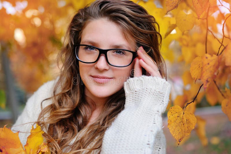 Portrait of beautiful woman wearing fashion glasses during the autumn stock image Portrait of beautiful woman wearing fashion glasses during the autumn stock image