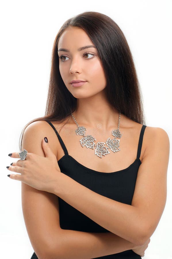 Portrait of beautiful woman wearing luxury silver Jewelery. Neck