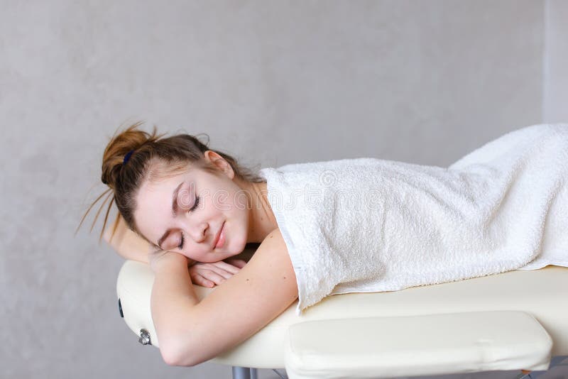 Portrait of beautiful woman who relaxes after massage and looks stock photography Portrait of beautiful woman who relaxes after massage and looks stock photography