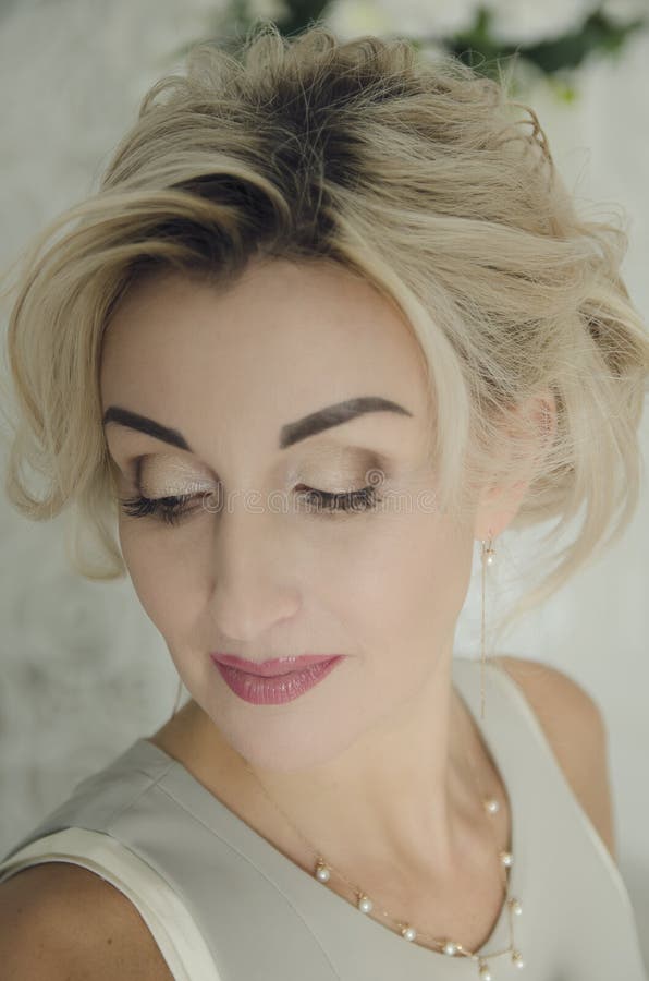 Portrait of a beautiful woman 40 years old with blond hair. Soft tinting royalty free stock image Portrait of a beautiful woman 40 years old with blond hair. Soft tinting royalty free stock image