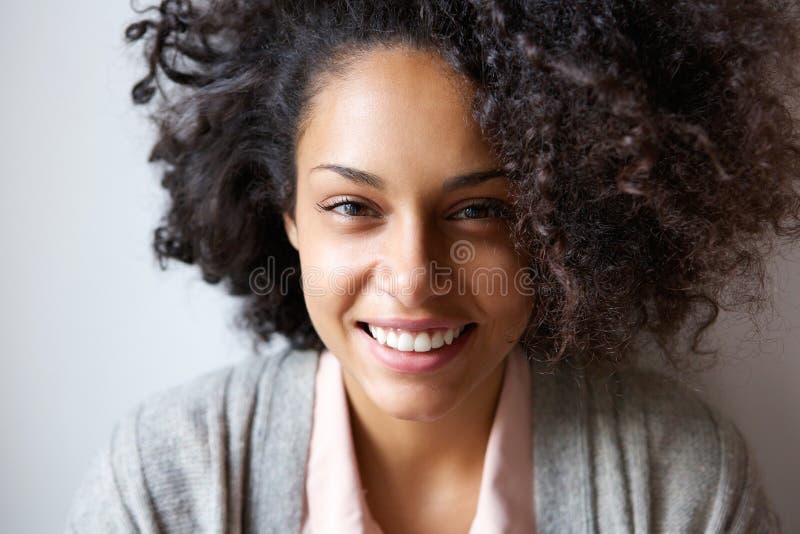 Portrait of a beautiful young african american woman smiling stock image