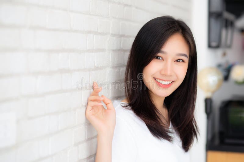 Portrait of beautiful young asian woman happiness standing on gr