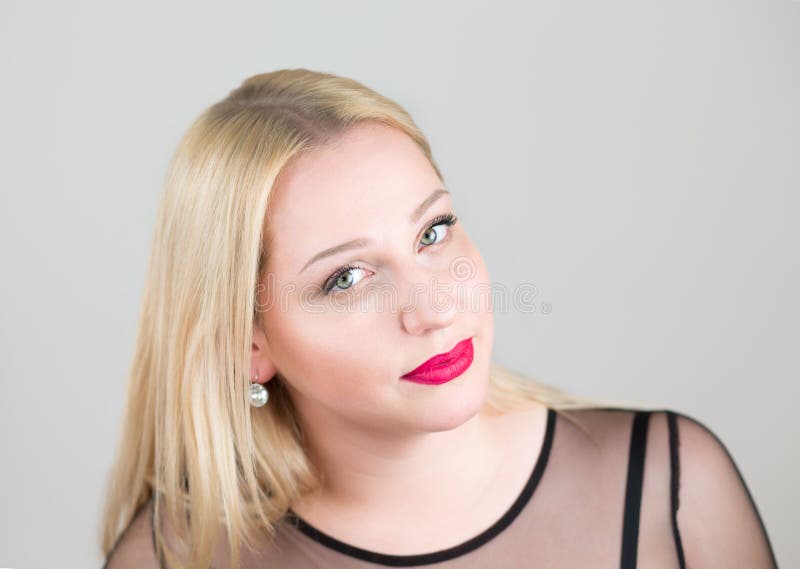 Portrait of a beautiful young blonde woman in an evening black dress close up. stock photos Portrait of a beautiful young blonde woman in an evening black dress close up. stock photos