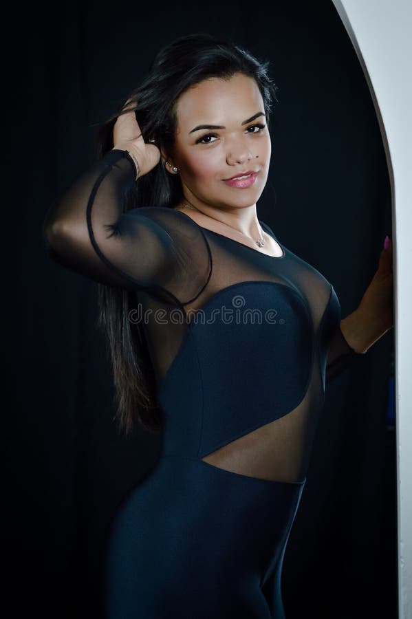 https://thumbs.dreamstime.com/b/portrait-beautiful-young-brazilian-woman-dressed-skintight-bodysuit-fixing-her-hair-seductively-portrait-beautiful-269350565.jpg