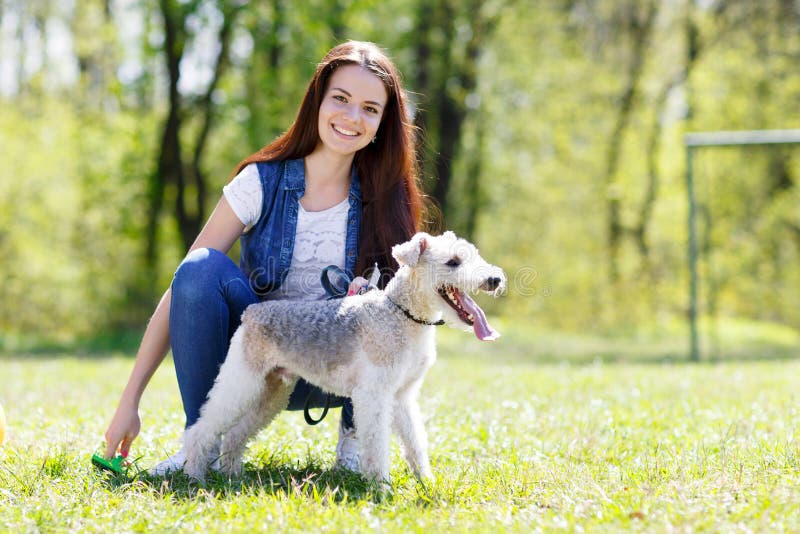 Portrait of Beautiful young girl with her dogs