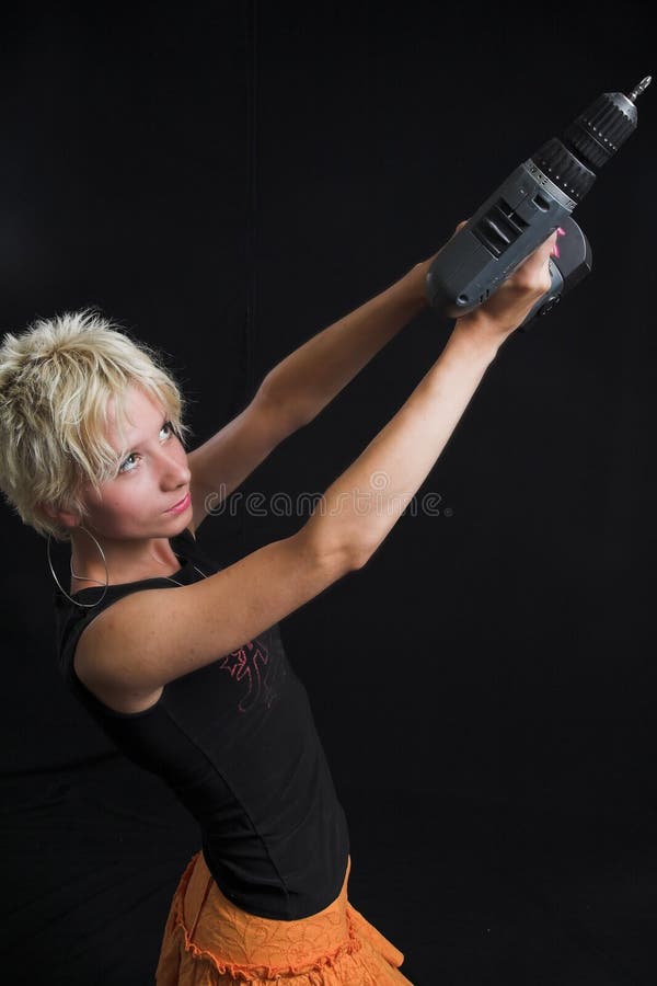 Portrait of beautiful young woman on black background