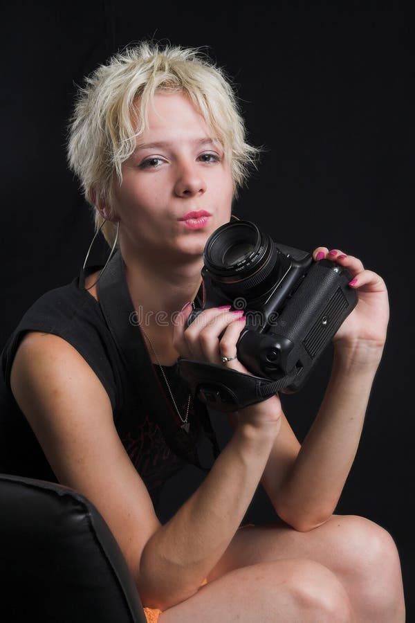 Portrait of beautiful young woman on black background