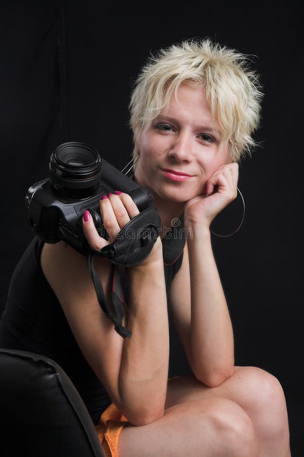 Portrait of beautiful young woman on black background