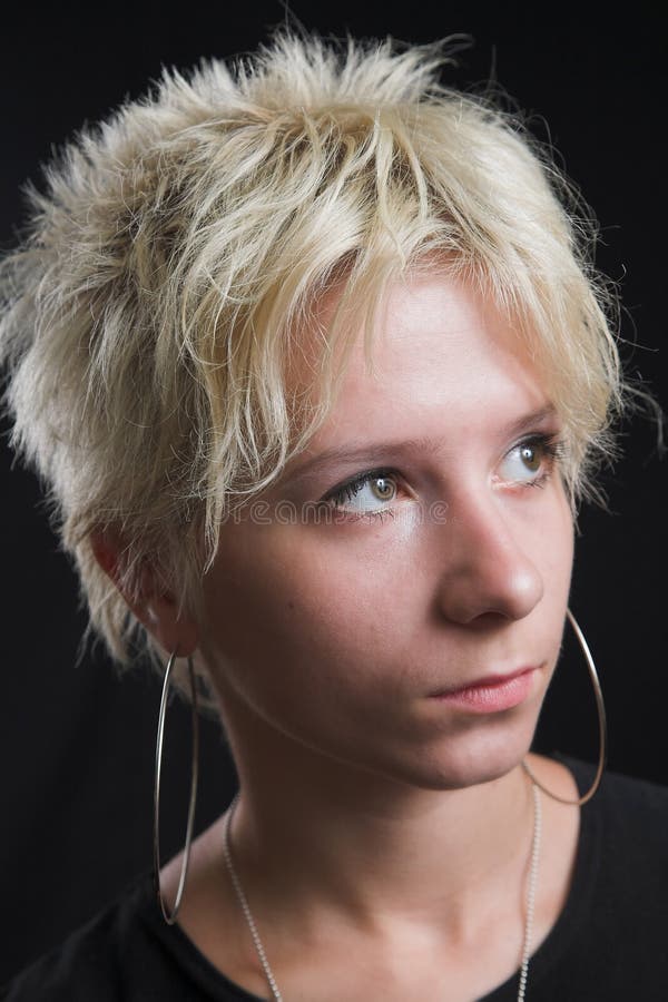 Portrait of beautiful young woman on black background