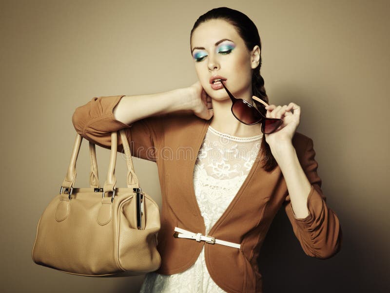 Portrait of beautiful young woman with bag stock photography Portrait of beautiful young woman with bag stock photography