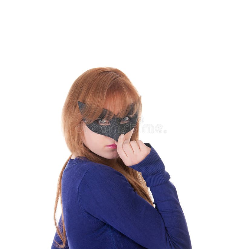 Portrait of a beautiful young woman in a black carnival mask