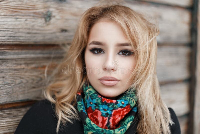 Portrait of a beautiful young woman with blond hair