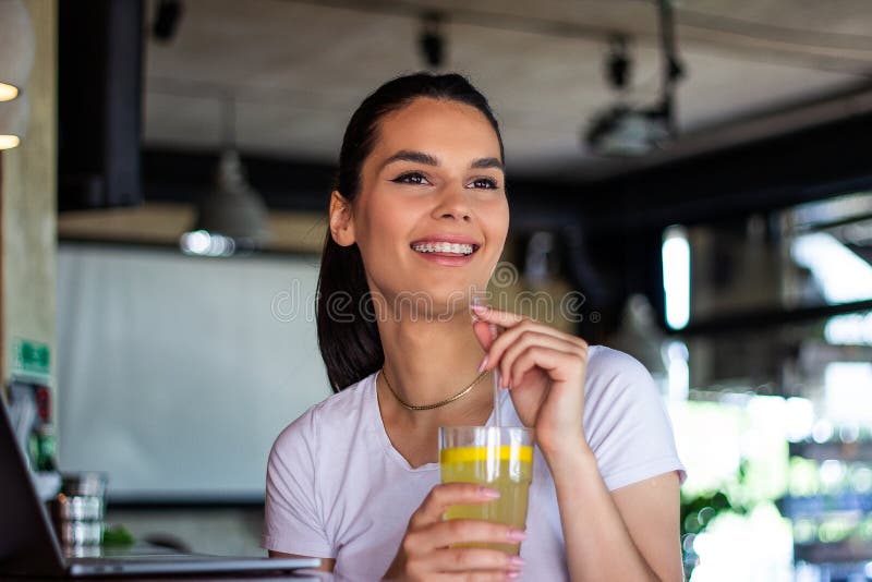 Portrait of Beautiful Young Woman Enjoying a Drink, Pretty Girl Sipping ...