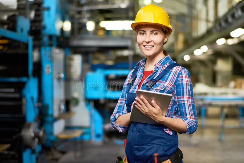 Happy Young Woman at Factory royalty free stock photos Happy Young Woman at Factory royalty free stock photos
