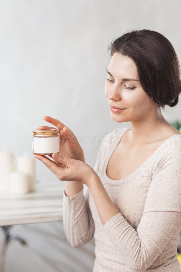 Portrait Of Beautiful Young Woman with Natural Makeup applying white Under Eye Patches Beauty Mask On Face. Girl with stock photos Portrait Of Beautiful Young Woman with Natural Makeup applying white Under Eye Patches Beauty Mask On Face. Girl with stock photos