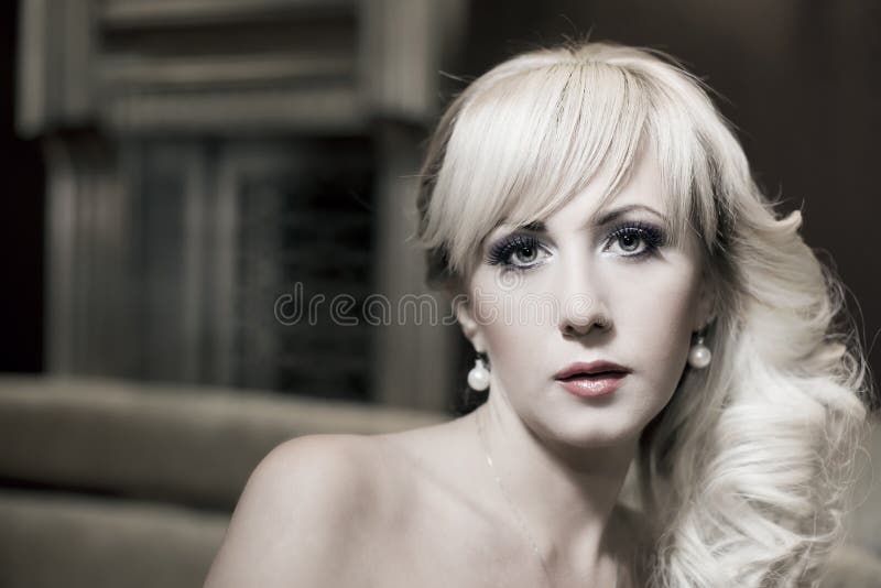 Portrait of beautiful young woman with pearls