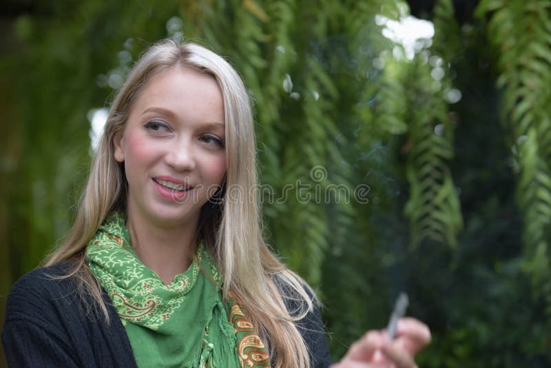 Portrait of a beautiful young woman smoking royalty free stock photos Portrait of a beautiful young woman smoking royalty free stock photos