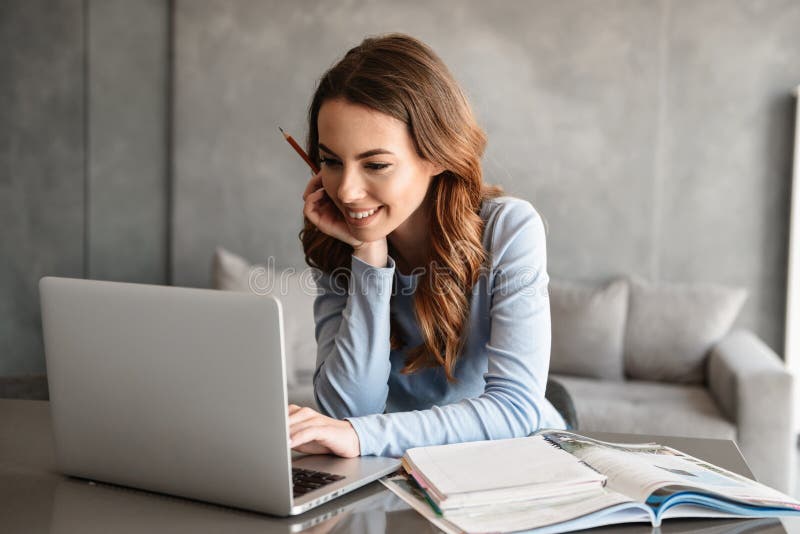 Portrait of a beautiful young woman studying