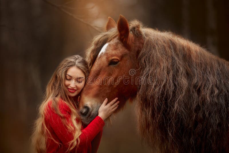 Portrait of a beautiful young woman with Tinker horse