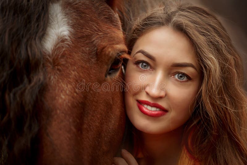 Portrait of a beautiful young woman with Tinker horse