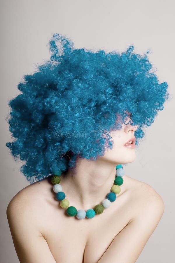 Portrait of beauty woman in a blue wig royalty free stock photo