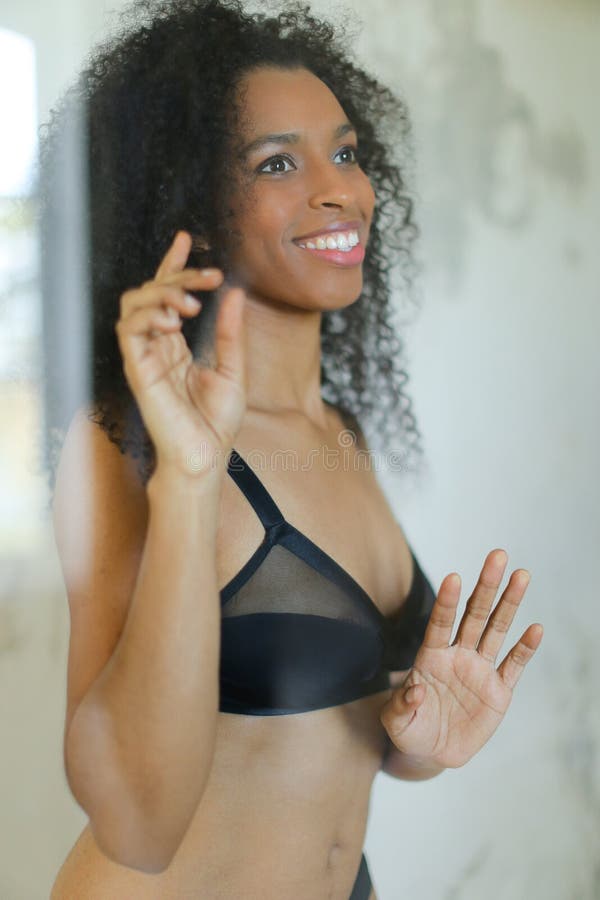 Beautiful toned Black woman in underwear looking for a drink at the fridge  in the morning Stock Photo - Alamy