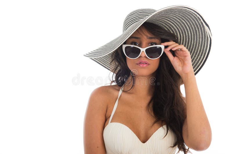 Portrait of black woman in white bikini with straw hat