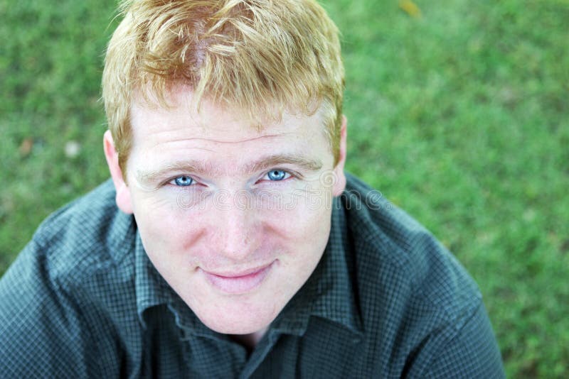 Portrait of a blond man with striking blue eyes