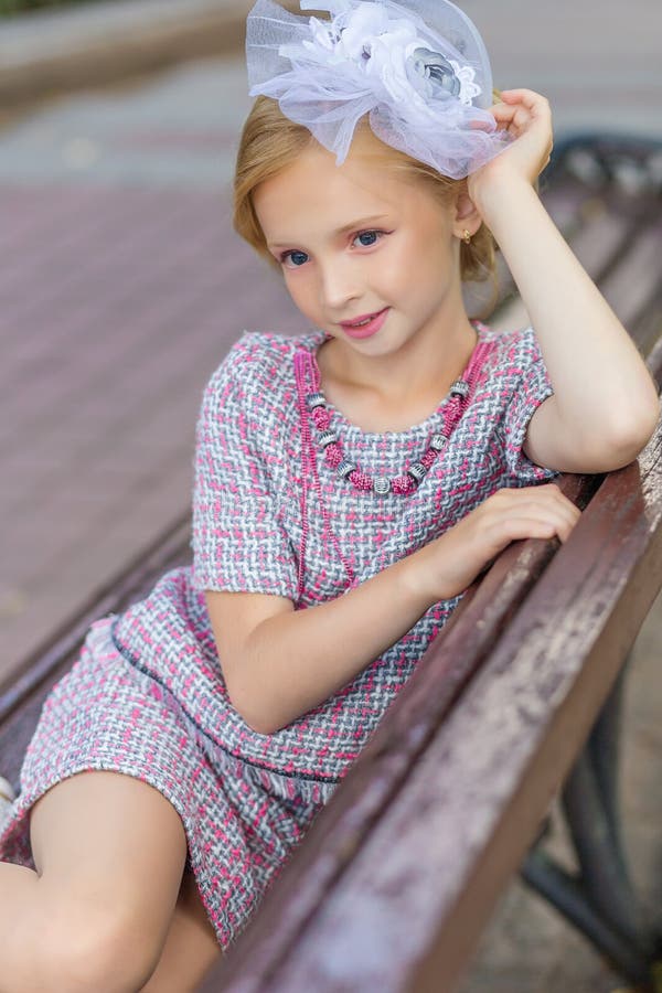 Portrait of a Blonde in Pink Attire in a Park Outdoors. Stock Image ...