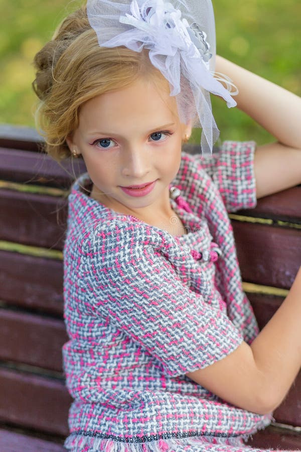 Portrait of a Blonde in Pink Attire in a Park Outdoors. Stock Image ...