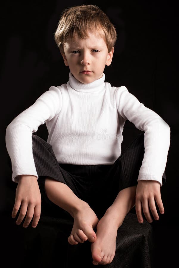 Portrait of the boy on a black background